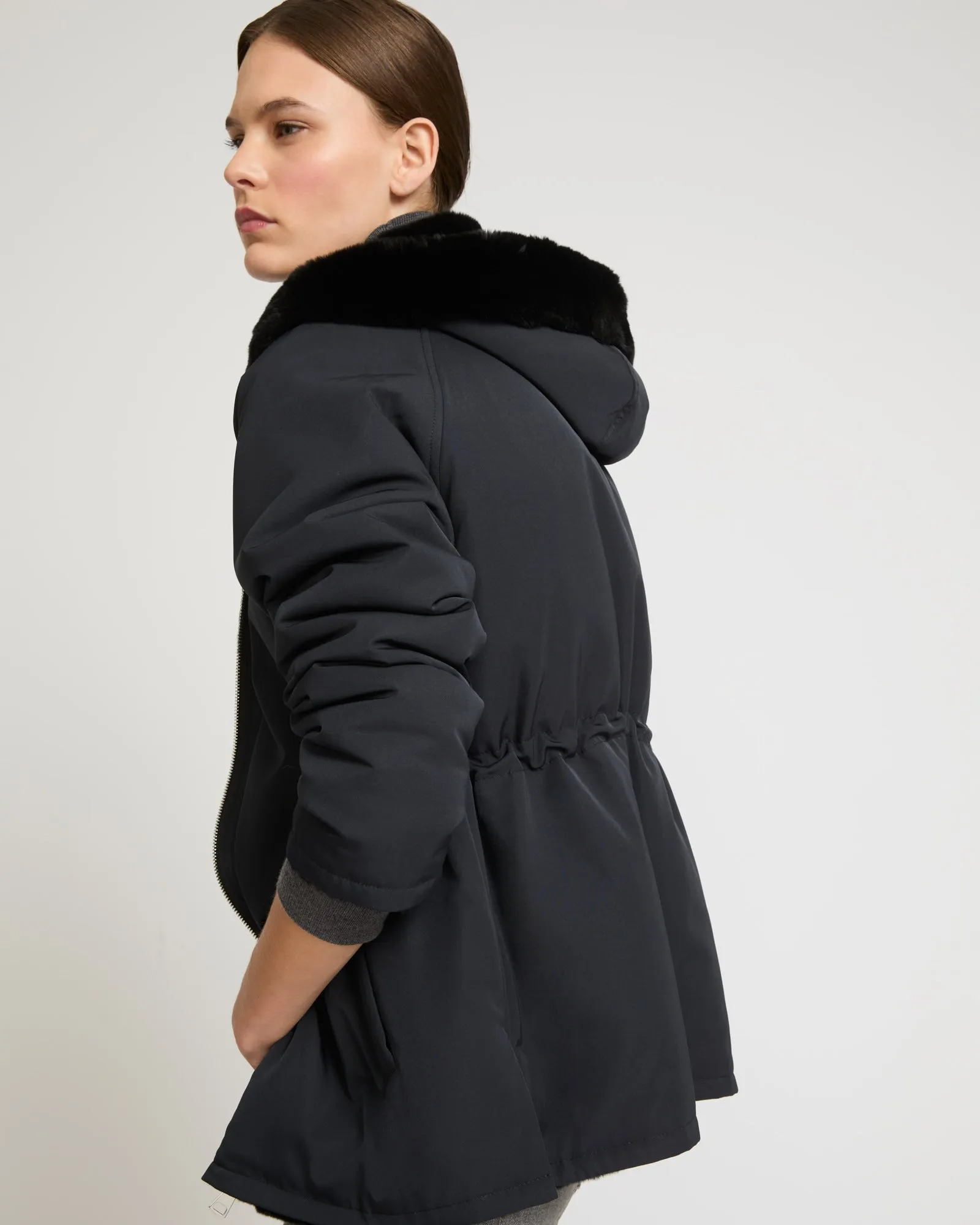 Reversible hooded parka in rabbit rex fur and technical fabric